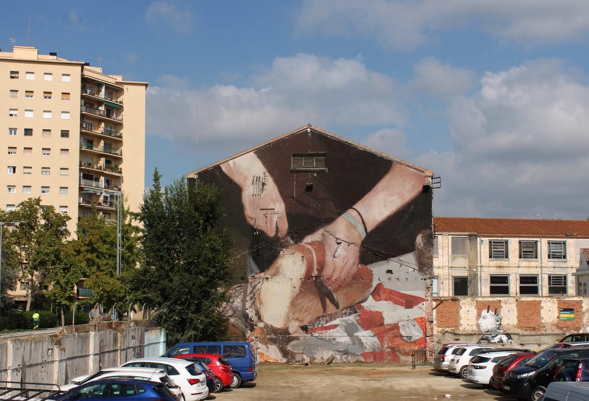 peinture murale réalisée par Mohamed L'Ghacham représentant une personne qui coupe du pain
