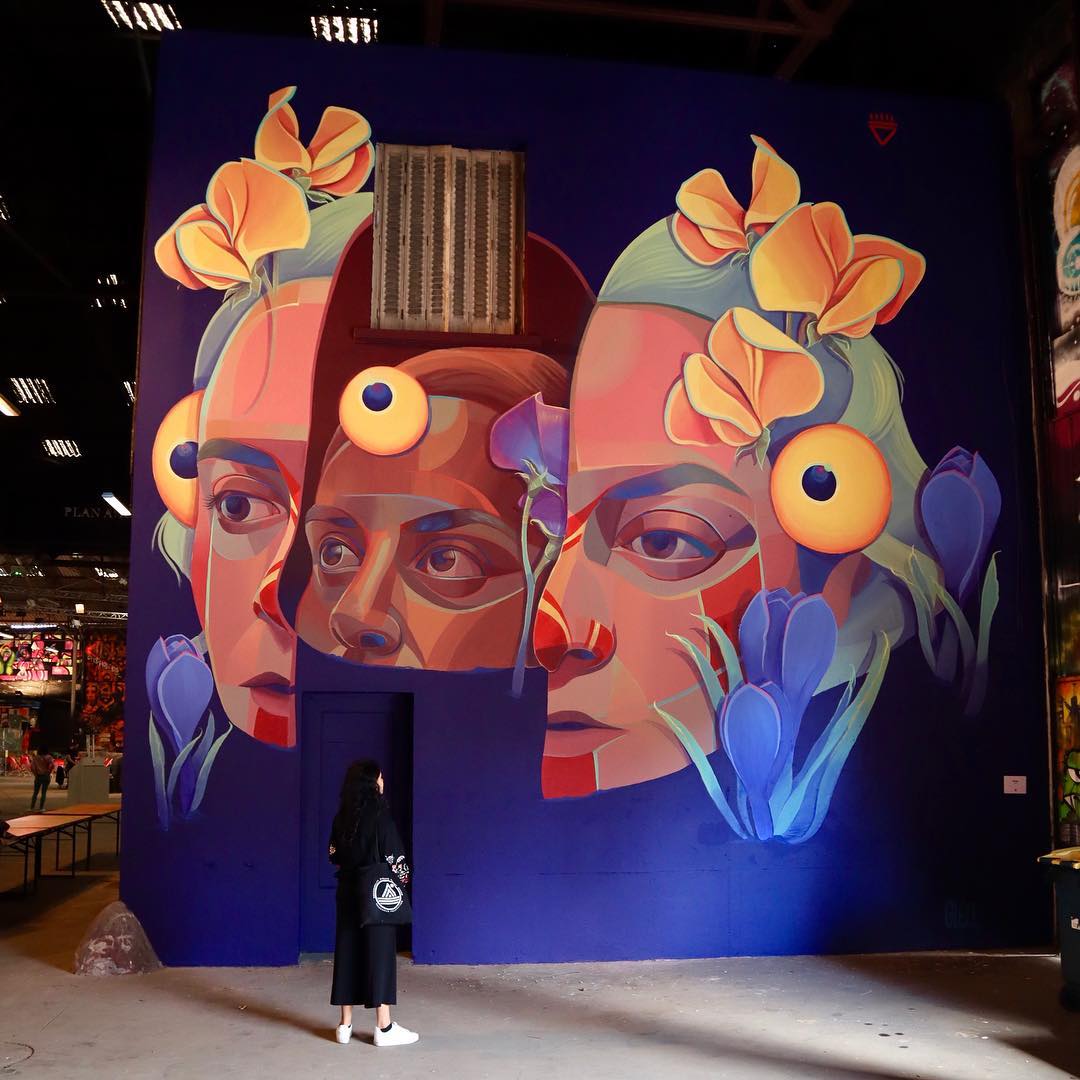 Femme à deux visages peinte par la street artiste Gleo