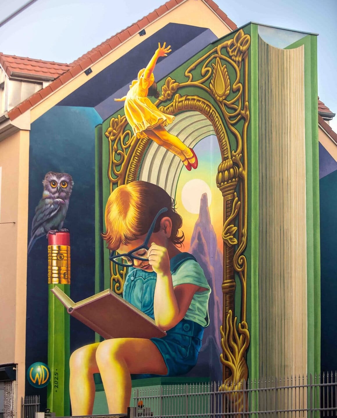 Peinture mural d'un enfant en train de lire par WD à Grenoble