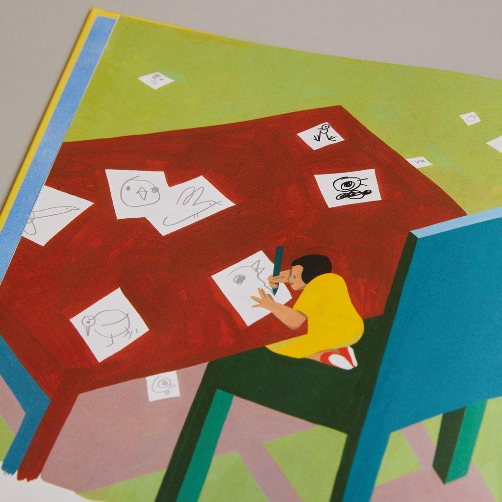 Illustration de Ping Zhu pour The Snail with the right Heart représentant un enfant dessinant sur une très grande table.